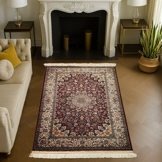 Rich maroon Persian silk carpet with floral detailing and central medallion design by Dash & Twine