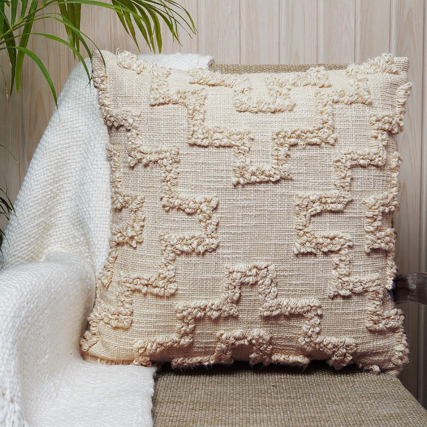 Handcrafted beige cotton cushion with maze-like loop embroidery and soft textured finish - Simply Graceful Collection