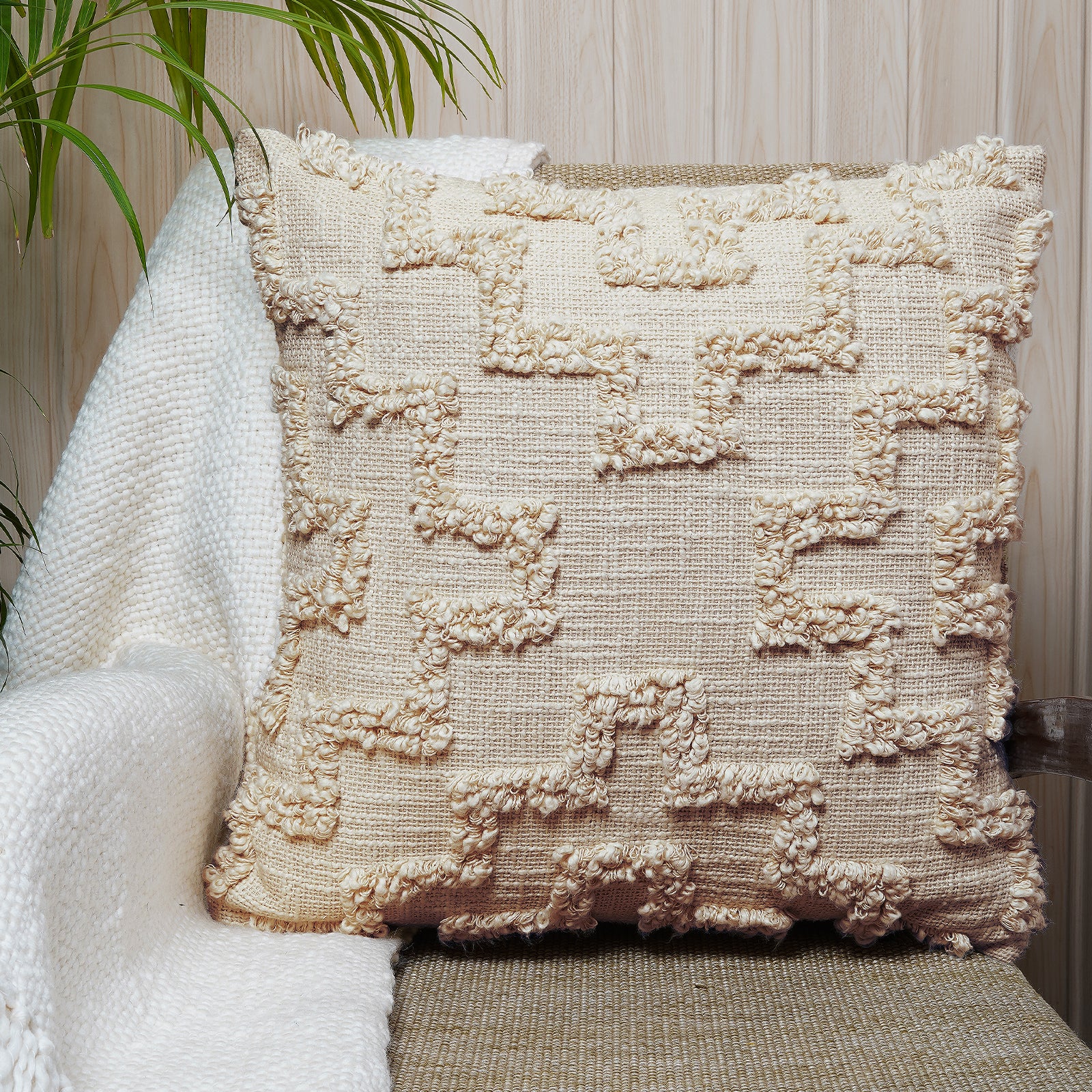 Handcrafted beige cotton cushion with maze-like loop embroidery and soft textured finish - Simply Graceful Collection