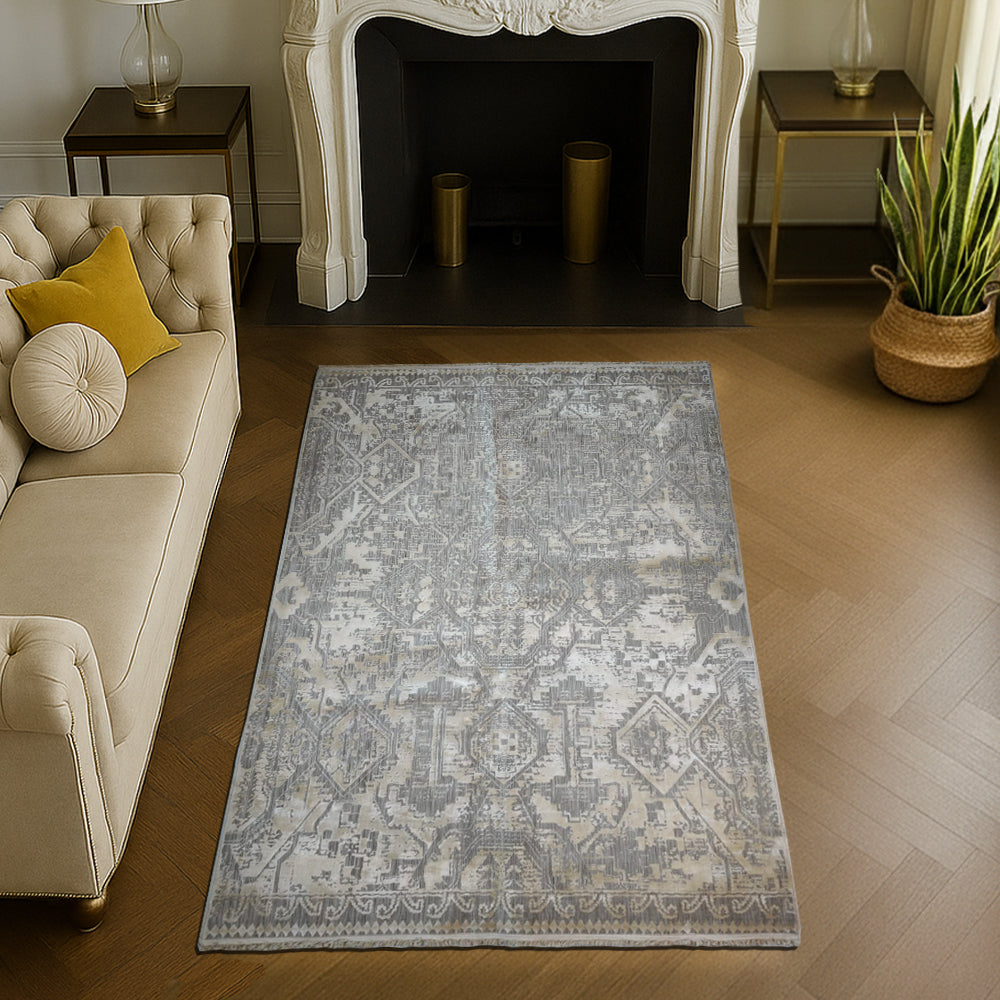 Modern grey silk carpet featuring mosaic-inspired silhouette patterns in soft beige and silver tones