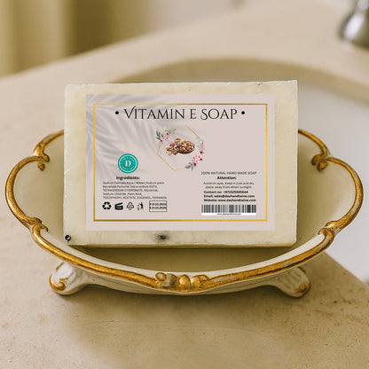 White handmade vitamin E soap bar with visible natural ingredients, ideal for skin repair and deep nourishment