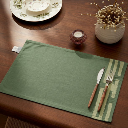  Jade green chambray placemat with soft stitched beige detail, minimalist design